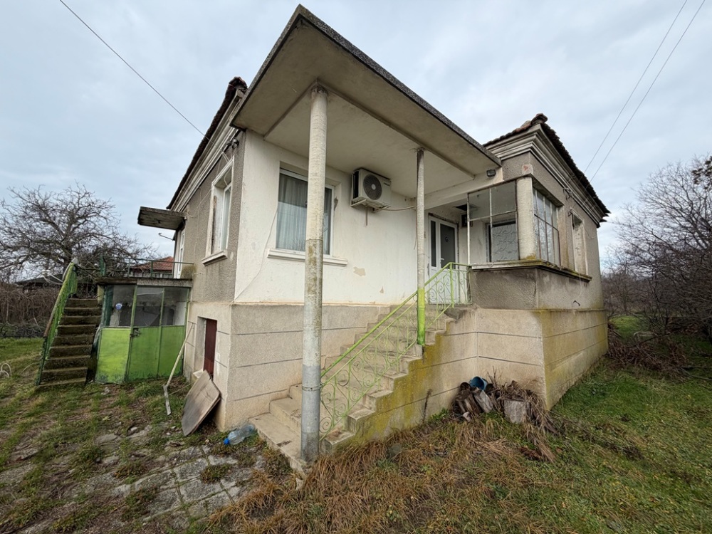Foto 1 von 4 — Парцел с къща