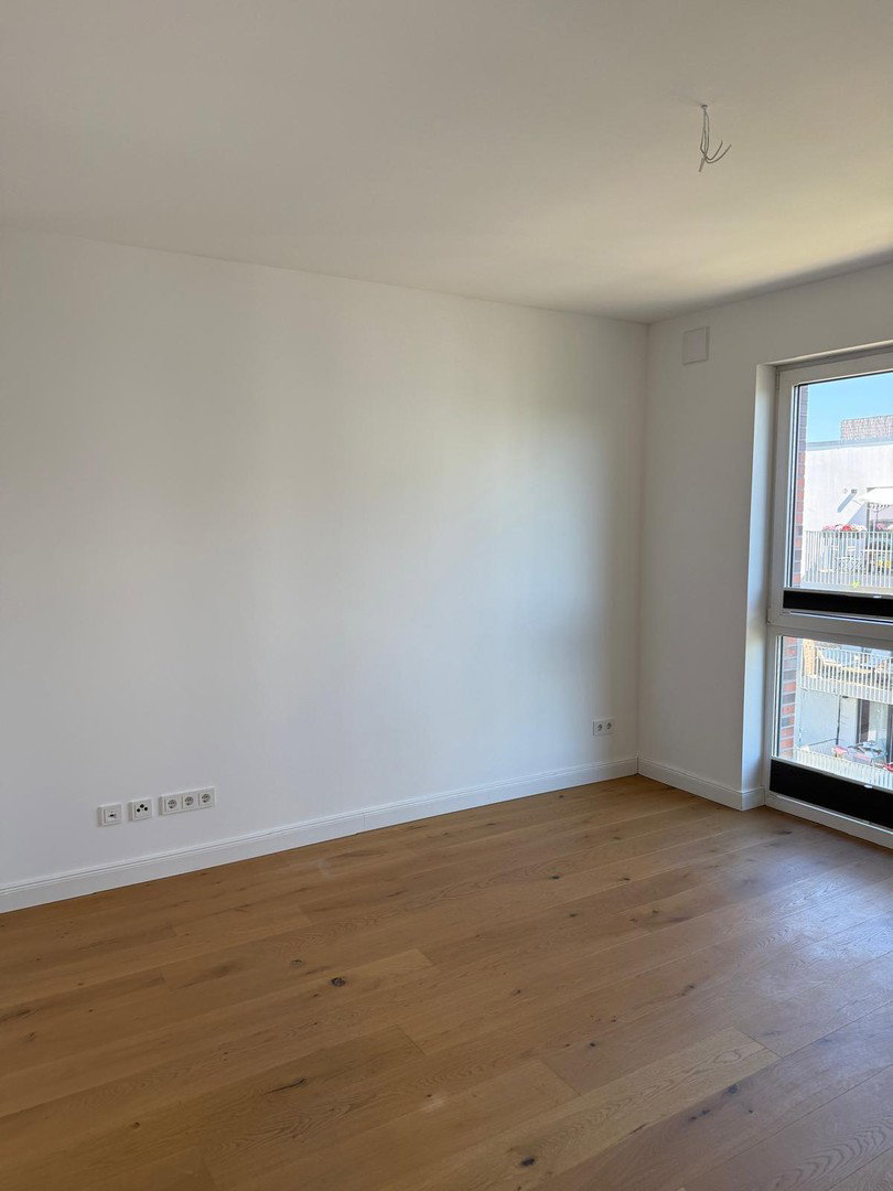 Foto 10 von 12 — Barrierefreie 4-Zimmer-Endetagenwohnung mit Balkon und Tiefgarage mit Wallbox