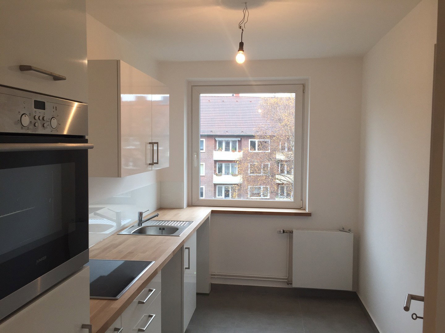 Foto 7 von 12 — 2 zentrale, helle 3 Zi Wohnungen, beide mit EBK, Balkon & TG Stellplatz