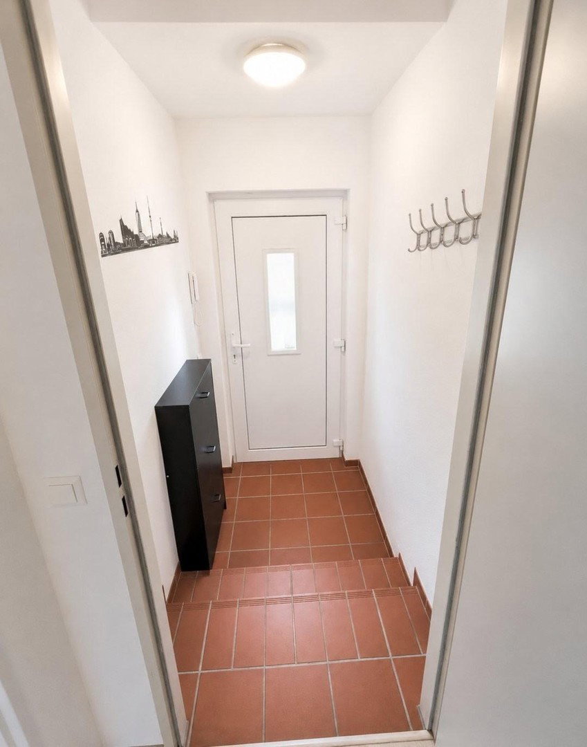 Foto 10 von 12 — Gepflegte 2-Zimmer-Wohnung mit Südwest-Terrasse, separatem Aufgang und Tiefgaragenstellplatz