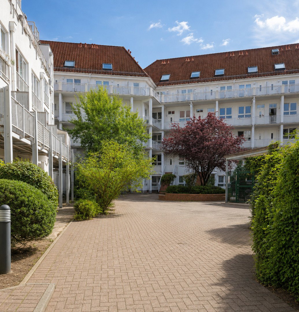 Foto 12 von 12 — Gepflegte 2-Zimmer-Wohnung mit Südwest-Terrasse, separatem Aufgang und Tiefgaragenstellplatz