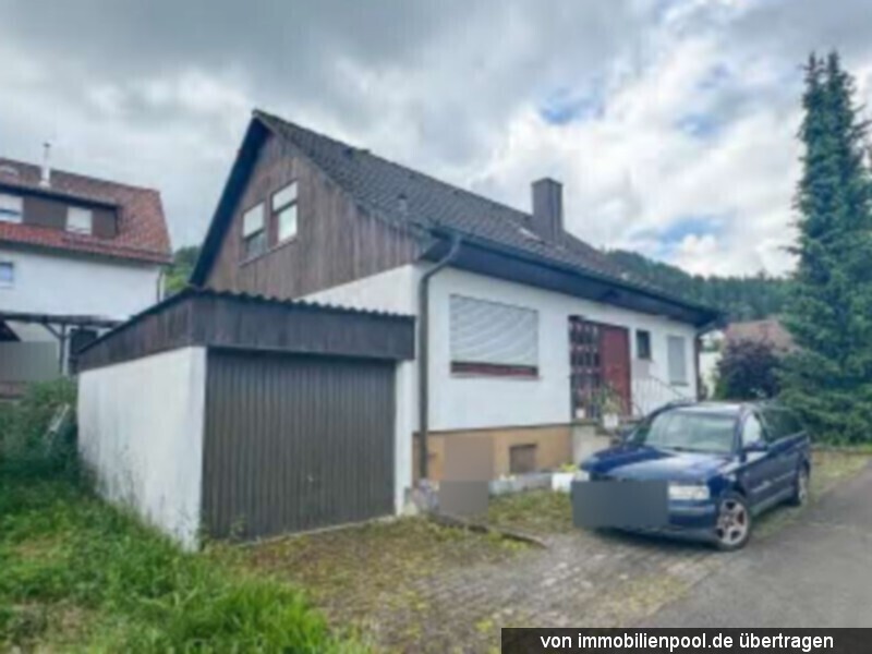 Foto 2 von 3 — Einfamilienhaus mit Garage