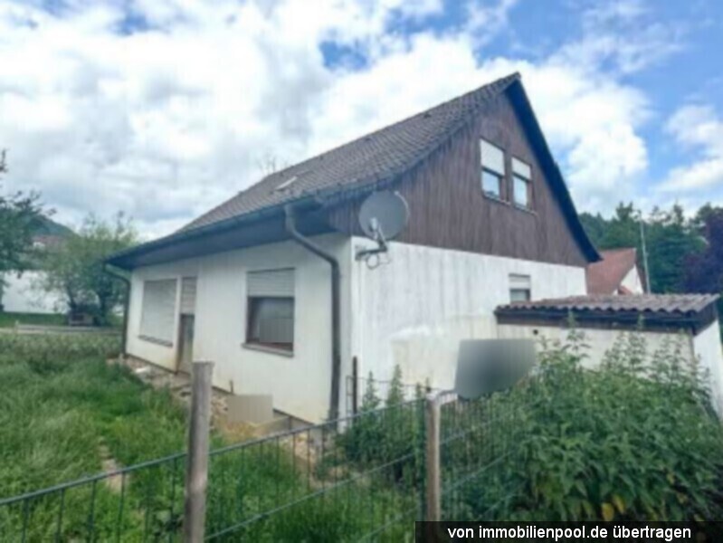Foto 3 von 3 — Einfamilienhaus mit Garage