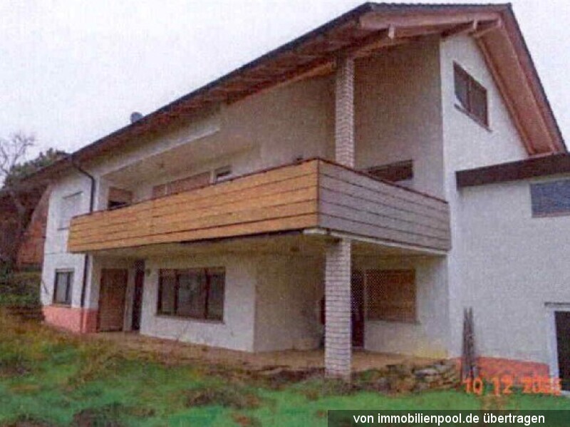 Foto 2 von 5 — Einfamilienhaus mit Einliegerwohnung und Garage