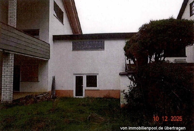Foto 4 von 5 — Einfamilienhaus mit Einliegerwohnung und Garage
