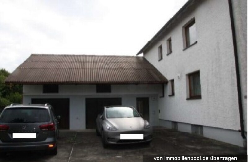 Foto 3 von 4 — Zweifamilienhaus mit Doppelgarage und Freisitz