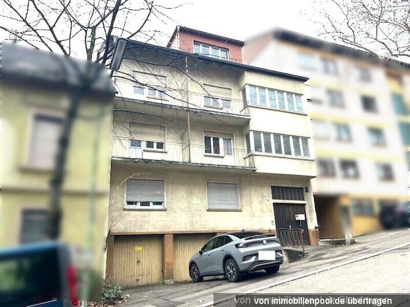 Foto 3 von 3 — Mehrfamilienhaus, Garagen und vorgelagertes Grundstück