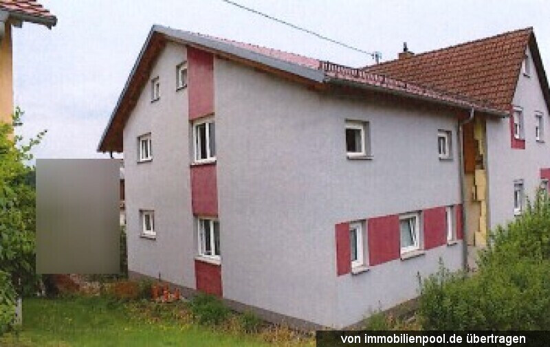 Foto 2 von 4 — Einfamilienhaus mit Garagen (1/2 Anteil)