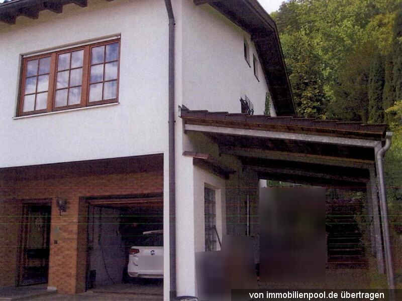 Foto 3 von 4 — Einfamilienhaus mit Garage und Carport