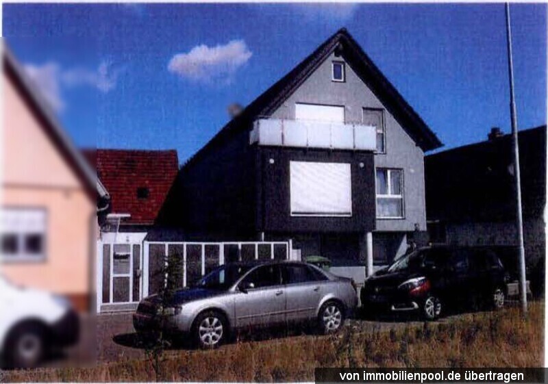 Foto 2 von 2 — Mehrfamilienwohnhaus