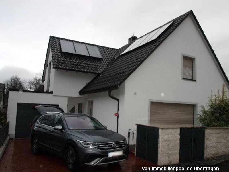 Foto 2 von 4 — Einfamilienhaus mit Garage