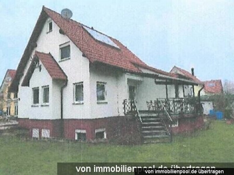 Foto 1 von 2 — Einfamilienhaus mit Einliegerwohnung