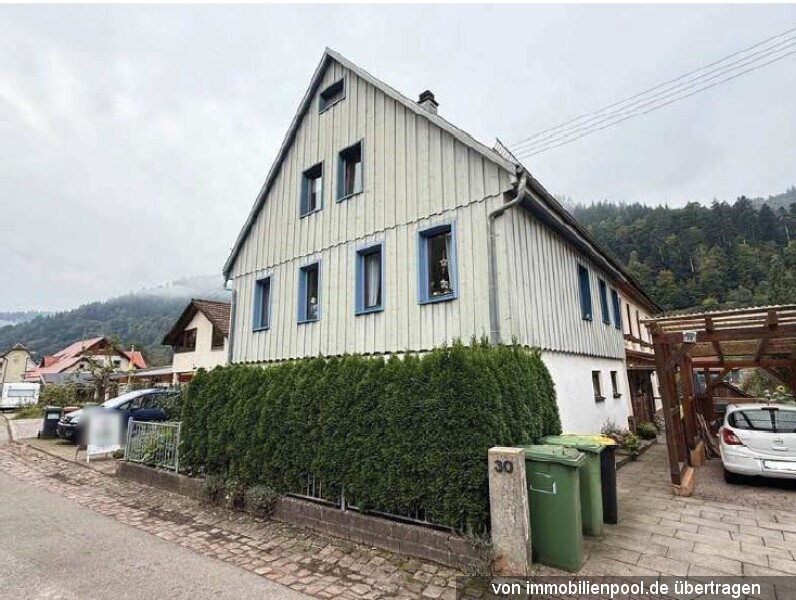 Foto 2 von 3 — Einfamilienhaus mit Einliegerwohnung und integrierter Garage