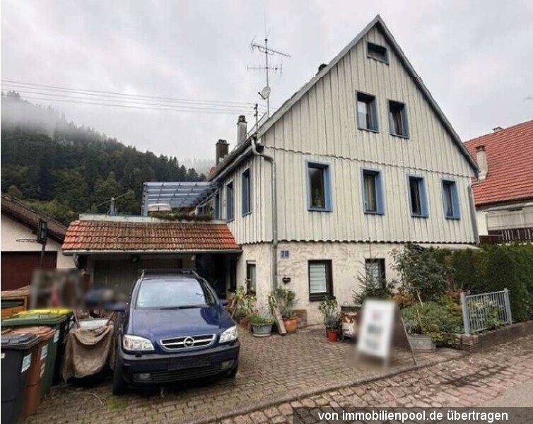 Foto 1 von 3 — Einfamilienhaus mit Einliegerwohnung und integrierter Garage