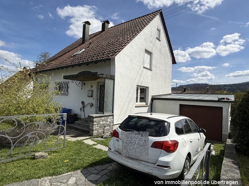 Foto 3 von 5 — Einfamilienhaus mit Einzelgarage