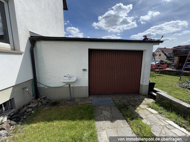 Foto 5 von 5 — Einfamilienhaus mit Einzelgarage