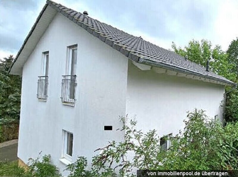 Foto 3 von 3 — Einfamilienhaus mit Garage
