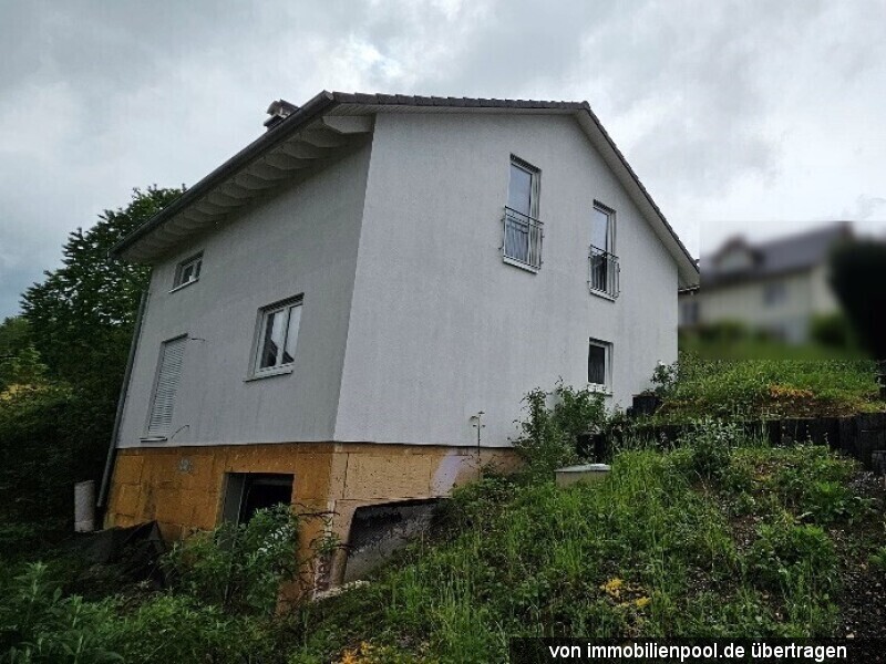 Foto 2 von 3 — Einfamilienhaus mit Garage