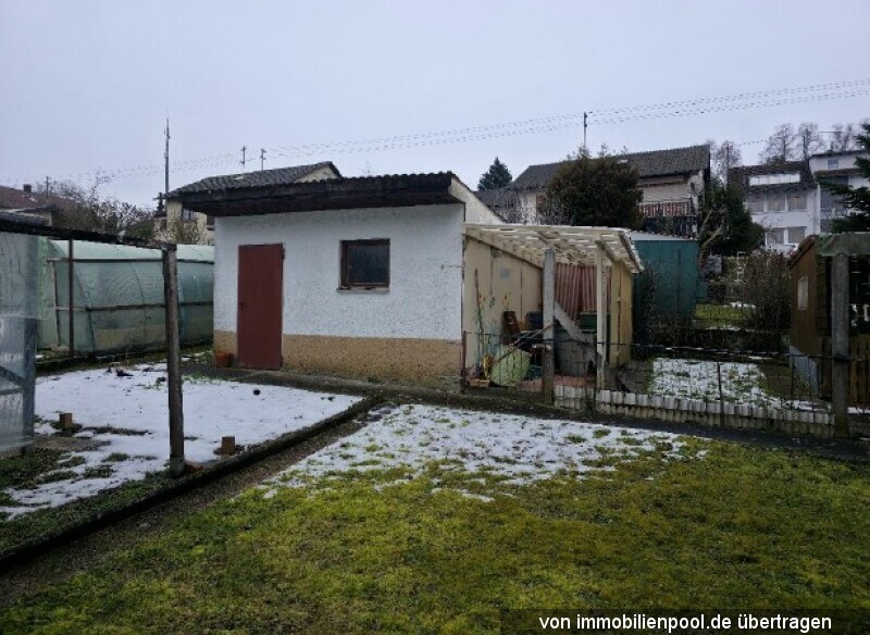 Foto 3 von 7 — zwei Wohnungen mit Garagen in einem Zweifamilienhaus