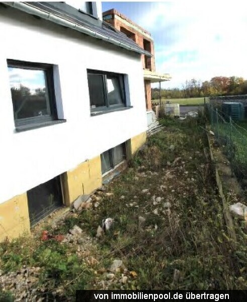 Foto 5 von 5 — 2-Familienhaus mit Einliegerwohnung und Flachdachanbau (Rohbau)
