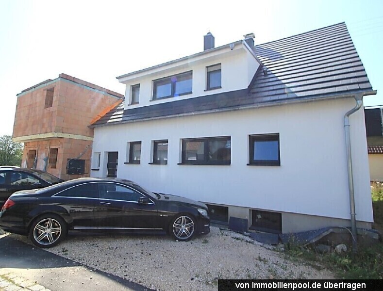 Foto 3 von 5 — 2-Familienhaus mit Einliegerwohnung und Flachdachanbau (Rohbau)