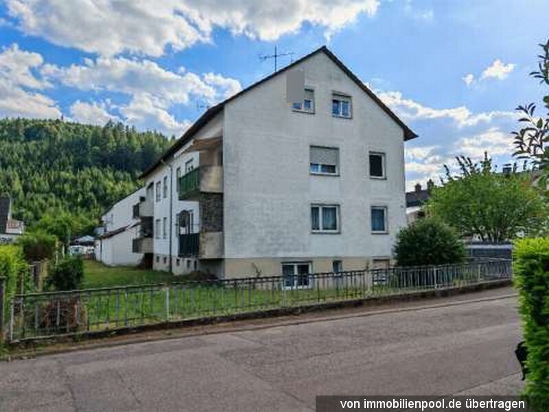 Foto 1 von 4 — zwei Mehrfamilienhäuser mit 10 Garagen