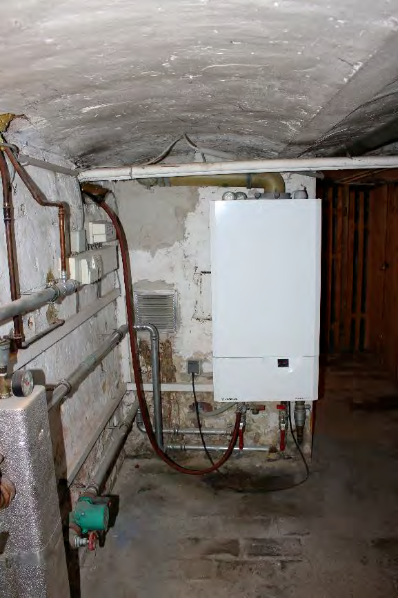 Foto 21 von 122 — Eigentumswohnung (1 bis 2 Zimmer), ETW Nr. 2 im EG: Diele, Schlafzimmer, Badezimmer, Wohnzimmer mit offenem Küchenbereich. Die ETW Nr. 2 ist zum Wertermittlungsstichtag vermietet.