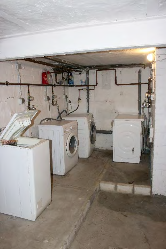 Foto 20 von 122 — Eigentumswohnung (1 bis 2 Zimmer), ETW Nr. 2 im EG: Diele, Schlafzimmer, Badezimmer, Wohnzimmer mit offenem Küchenbereich. Die ETW Nr. 2 ist zum Wertermittlungsstichtag vermietet.