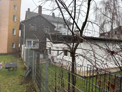Foto 8 von 9 — unbebautes Grundstück, Garage, Gewerbeeinheit (z.B. Laden, Büro), Mehrfamilienhaus
