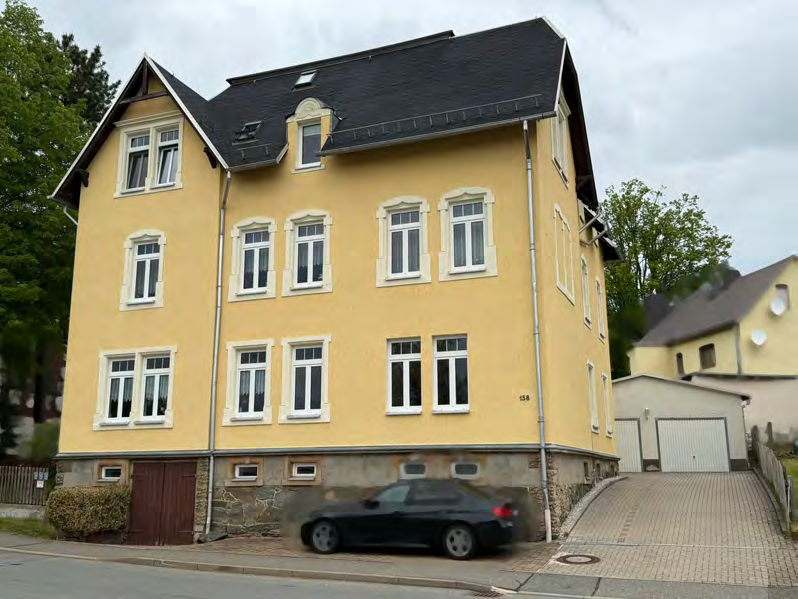 Foto 2 von 21 — Mehrfamilienhaus