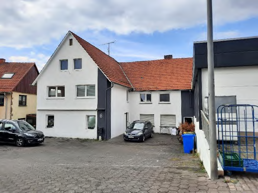Foto 1 von 2 — Mehrfamilienhaus, gewerblich genutztes Grundstück