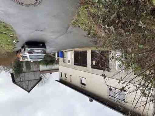 Foto 1 – Einfamilienhaus, unbebautes Grundstück
